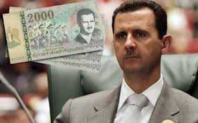 بشار الأسد يطبع صورته على أوراق نقدية لأول مرة منذ توليه الحكم